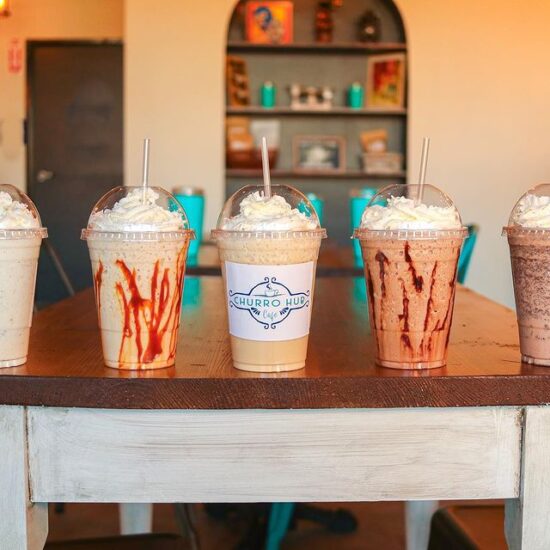 Four iced coffee drinks at Churro Hub Cafe.