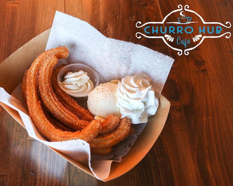 Churros with ice cream and whipped cream.