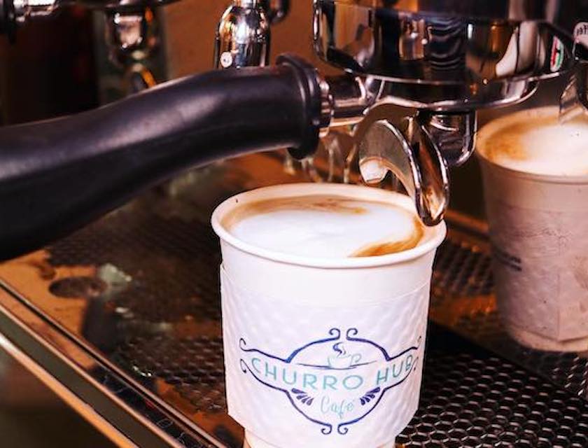 Espresso machine pouring coffee into a cup.