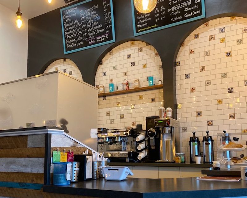 Coffee shop counter with espresso machines.